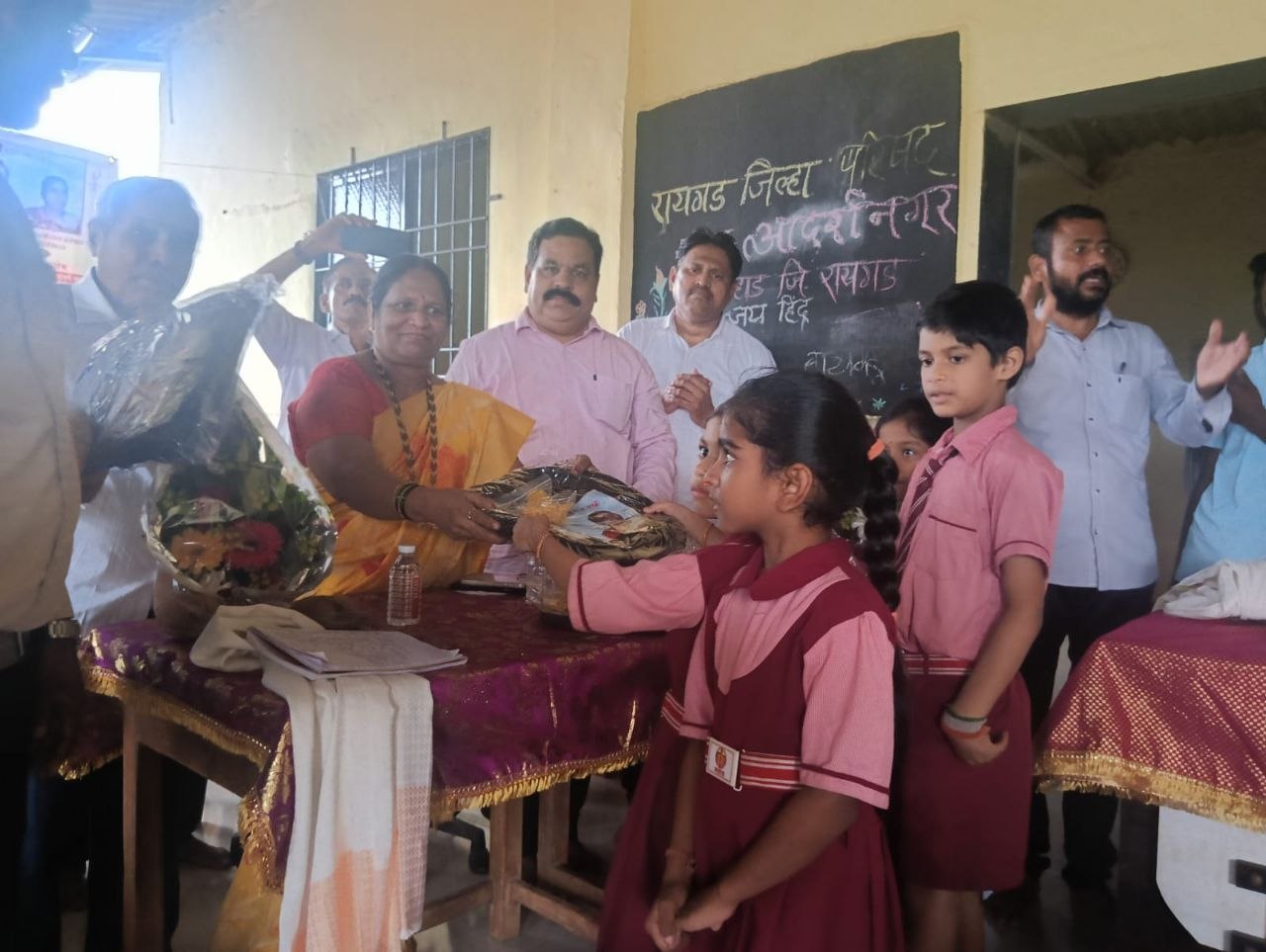 Children receiving school bags during a distribution drive