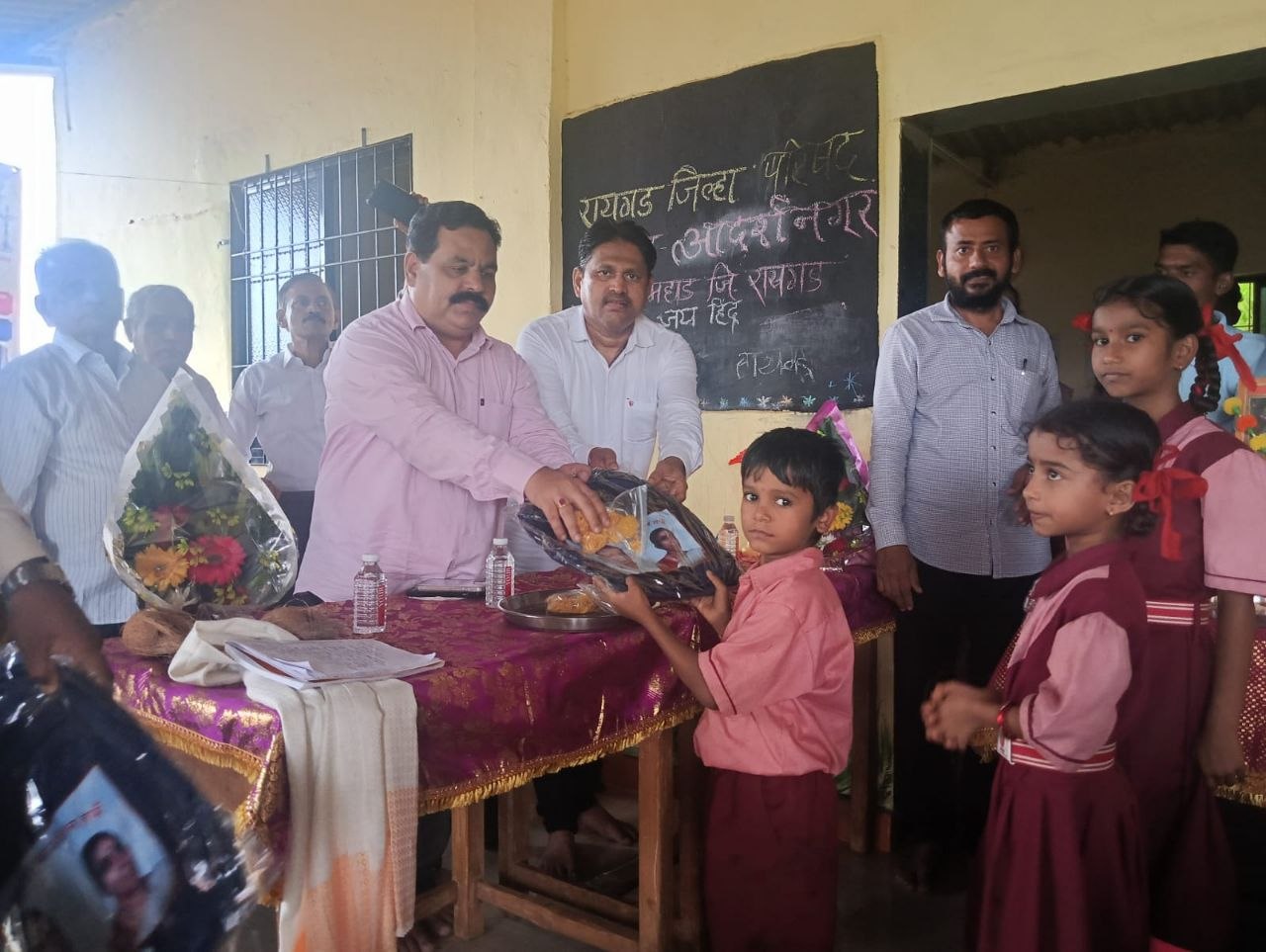 Children receiving school bags during a distribution drive